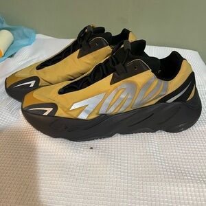 Yeezy Gold and Black Sneakers with White Stripes